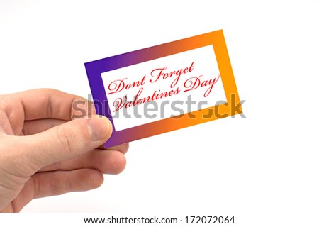 Card with "Don't Forget Valentines Day" held in hand