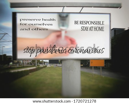 On the billboard writes: STOP PANDEMIC CORONAVIRUS, preserve health for ourselves and others, be responsible stay at home, the person washes his hands, blurred image.