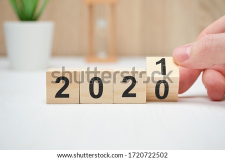 The concept of changing the year from 2020 to 2021 and the results of operations. Close up. Royalty-Free Stock Photo #1720722502