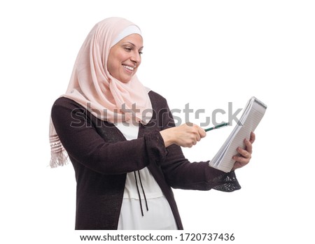 Happy Arab Muslim businesswoman found a solution dressed in traditional Islamic clothing, isolated on white background