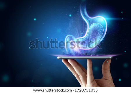 Hologram of the stomach, endoscopy procedure. Digestive tract and stomach disease concept. Mixed medium, copy space Royalty-Free Stock Photo #1720751035
