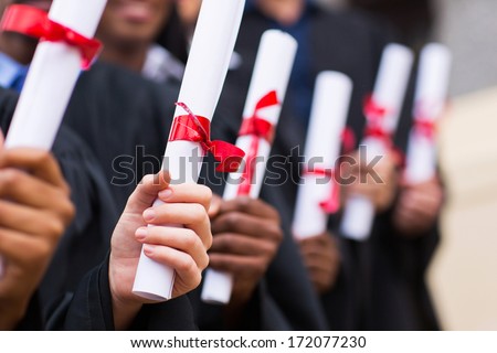 group of multiracial graduates holding diploma Royalty-Free Stock Photo #172077230