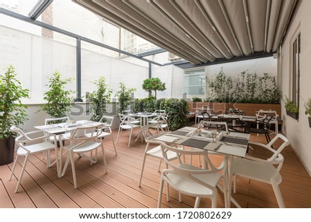 Beautiful restaurant summer terrace interior with moving roof
