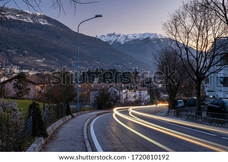 
Night lights of cars on the streets of Trento