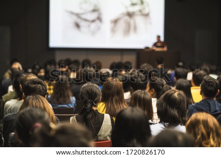 Rear view of Asian audience joining and listening speaker talking on the stage in the seminar meeting room or conference hall, education and workshop, associate and startup business concept Royalty-Free Stock Photo #1720826170