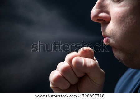 Spread of pathogens when coughing shown with a man against a black background Royalty-Free Stock Photo #1720857718