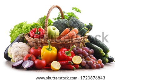 Assorted organic vegetables and fruits in wicker basket isolated on white background. Royalty-Free Stock Photo #1720876843