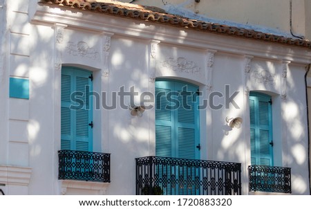 White building in tropical city morning