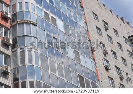 Facades of modern buildings in a megalopolis in sunny weather