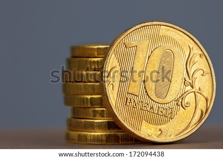stack of a coins on the gray background