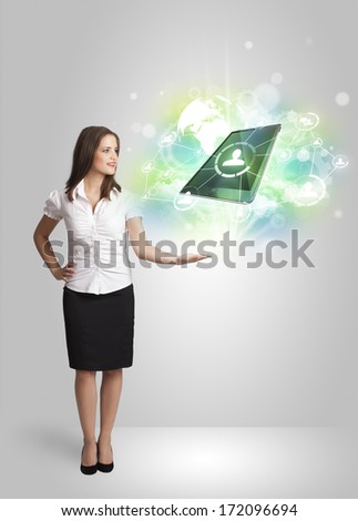 Business girl showing modern green tablet technology concept