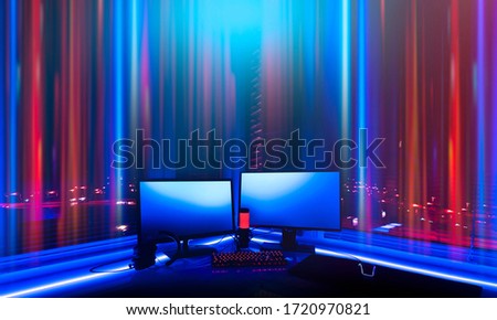 Room with neon lights. Game Zone. Interior for computer games, game sports and stream. Abstract neon background in the interior. Night view of the room, white table, neon light. Blue and pink neon.