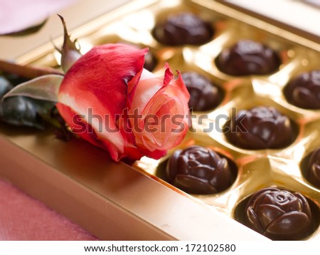 Beautiful rose and chocolate candies for Valentine's Day or Mother's Day, selective focus 