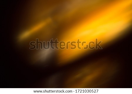 Abstract black background with yellow and orange rays Royalty-Free Stock Photo #1721030527