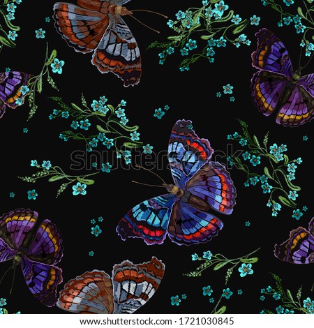 Embroidery. Colorful butterflies and green meadow flowers. Seamless pattern. Summer garden art. Template for clothes, textiles, t-shirt design 