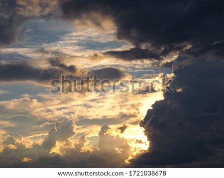Clouds and golden light shining through