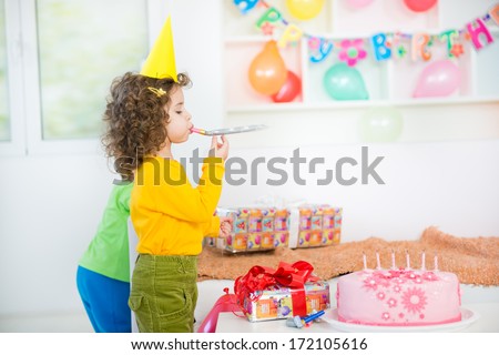 A group of children at a birthday party. blurred motion and shallow doff.