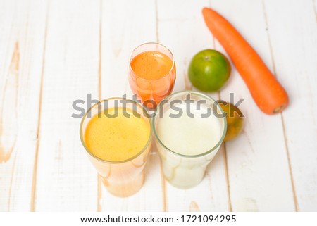 Healthy diet Fruits and vegetables juice ready to drink on wooden table 
