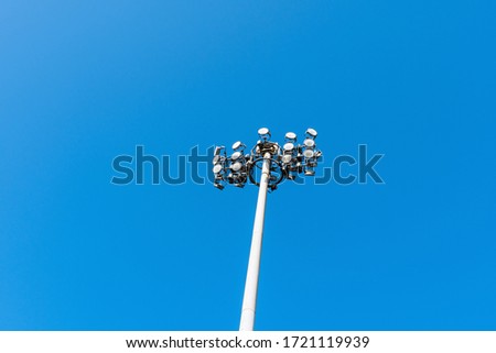 Spolight tower or pole with blue sky background