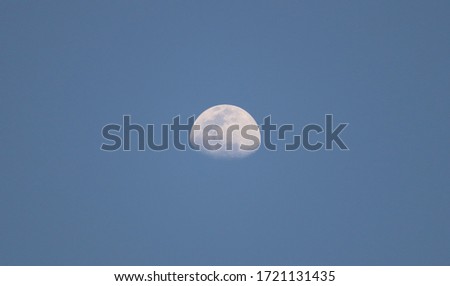 A beautiful day moon image looks amazing feel like nature beauty