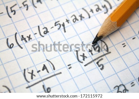 math problems on graph paper with pencil Royalty-Free Stock Photo #172115972