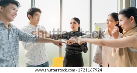 Conflict of female teamwork office worker. failuare meeting asian businesman and woman hand point each others to blame coworker Argument ideas concept Royalty-Free Stock Photo #1721167924