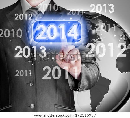 Businessman touching new year 2014