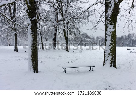Bench in snow at Bois de Vincennes