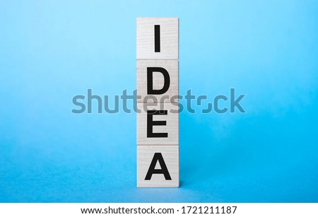 idea word on wooden cubes on light blue background