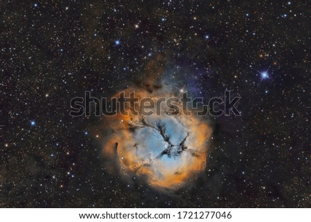 According to NASA, M20 is a star-forming nebula located 9,000 light-years away from Earth in the constellation Sagittarius. Also known as the Trifid Nebula, M20 has an apparent magnitude of 6.3 and ca