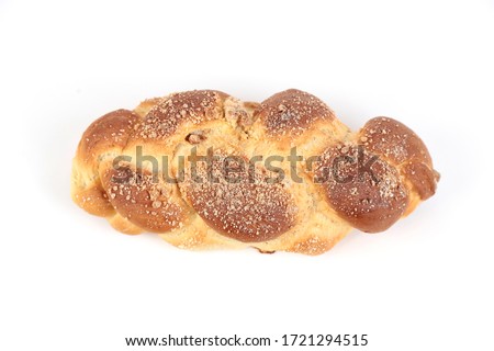 Top view of homemade challah on white background.