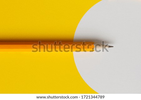 An interactive photo composition of an orange pencil and space for creative thinking (text) is used for presentation in the field of education, business or creativity. Yellow white background