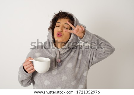Leisure lifestyle people person celebrate flirt coquettish concept. Beautiful pretty cheerful gorgeous  making v-sign near eyes wearing pyjama standing against gray wall.