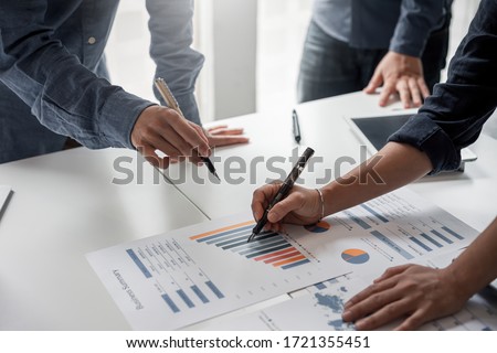 Business people meeting and planning business strategies together in the office. Royalty-Free Stock Photo #1721355451