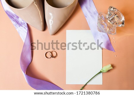 wedding rings on orange background