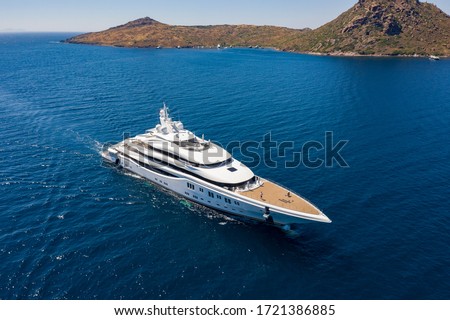 Aerial photo of luxury super yacht on the sea and marina Royalty-Free Stock Photo #1721386885