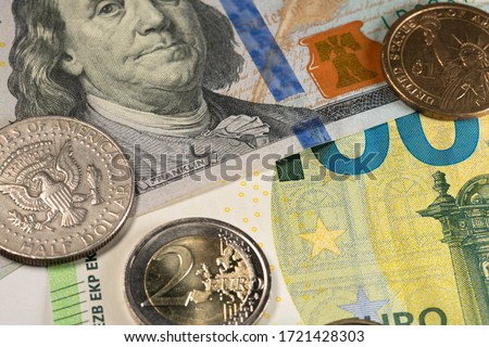 Euro and Dollar coins on Banknotes of the USA and European Union