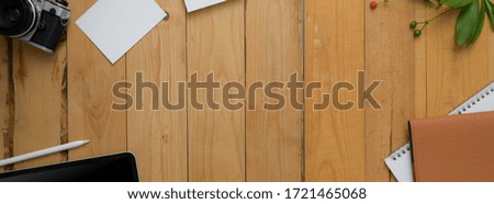 Top view of modern rustic workspace with office supplies and copy space on wooden table 