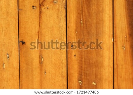 The texture and pattern of brown wood panels