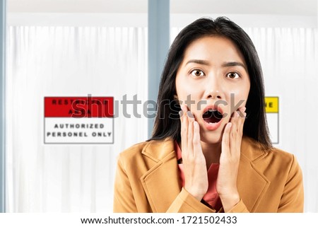 Asian businesswoman shocked in front of the quarantine room in the hospital