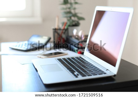 Computer and office supplies on office workplace in home