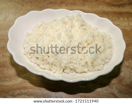 White steamed rice on a bowl.