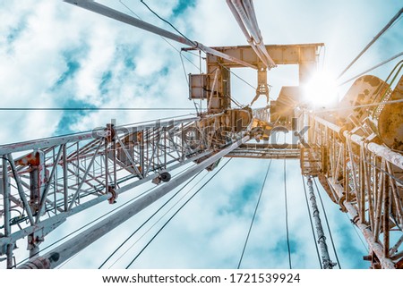 Drilling rig in oil field for drilled into subsurface in order to produced crude, inside view. Petroleum Industry. Onshore drilling rig. Royalty-Free Stock Photo #1721539924