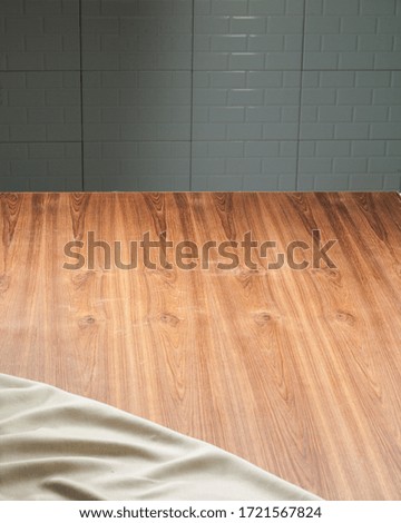 An empty wooden table for cooking in the kitchen, lighting through the window.