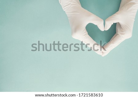 Doctor hands with medical gloves making heart shape, health insurance, donation, charity during covid-19 coronavirus, saving life, thank you and appreciation to doctor, world cancer day Royalty-Free Stock Photo #1721583610
