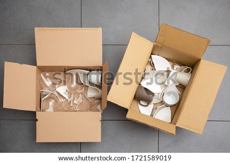 Keep broken dishes or glass put in the box for safety, concept Keeping broken items safe for children.
 Royalty-Free Stock Photo #1721589019