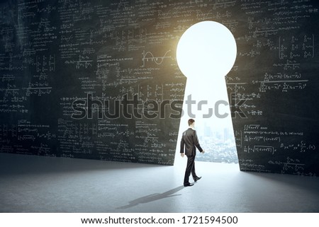 Businessman walking to keyhole with drawing mathematical formulas with city view. Science and idea concept.