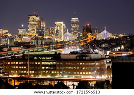 Night Boston Skycraper Skylines office downtown building with along Boston bay harbor at from Chelsea district. Boston is the capital city of the Commonwealth of Massachusetts in the United States