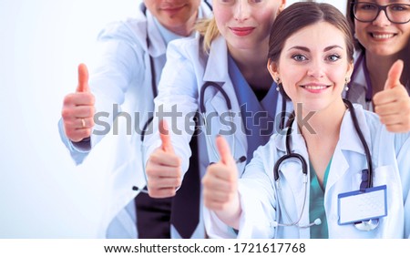 Portrait of doctors team showing thumbs up