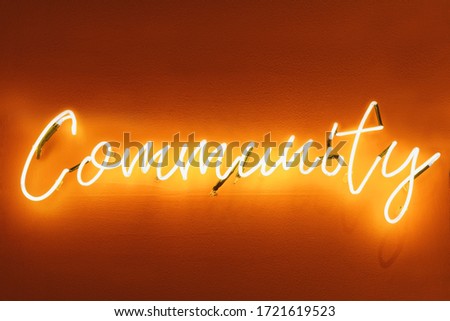 Community Type font Neon sign Signage on wall 